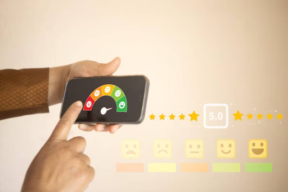 A hand holds a smartphone displaying a happiness meter and a 5.0-star rating, indicating user satisfaction and feedback.