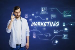A person gestures with a raised finger in front of a blue background featuring various digital marketing icons and the word 'MARKETING.'