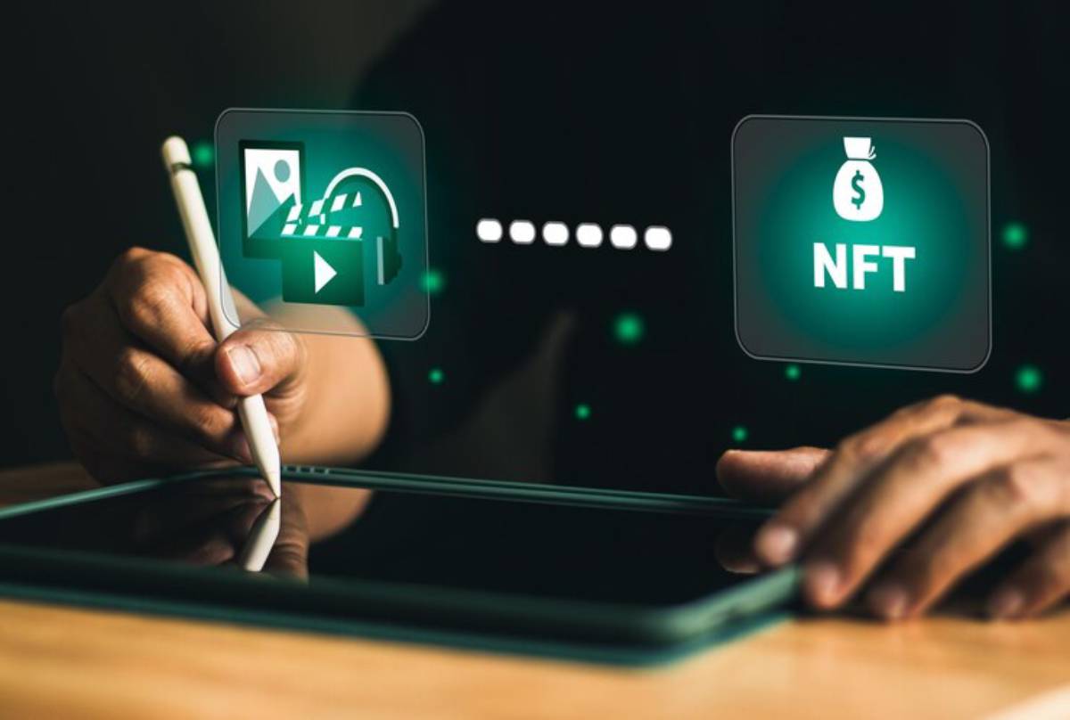 A person uses a digital pen on a tablet, surrounded by icons related to digital content and NFTs.