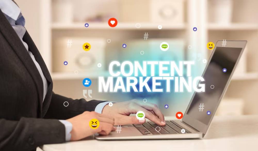 A business professional types on a laptop, with 'Content Marketing' and social media icons floating above.